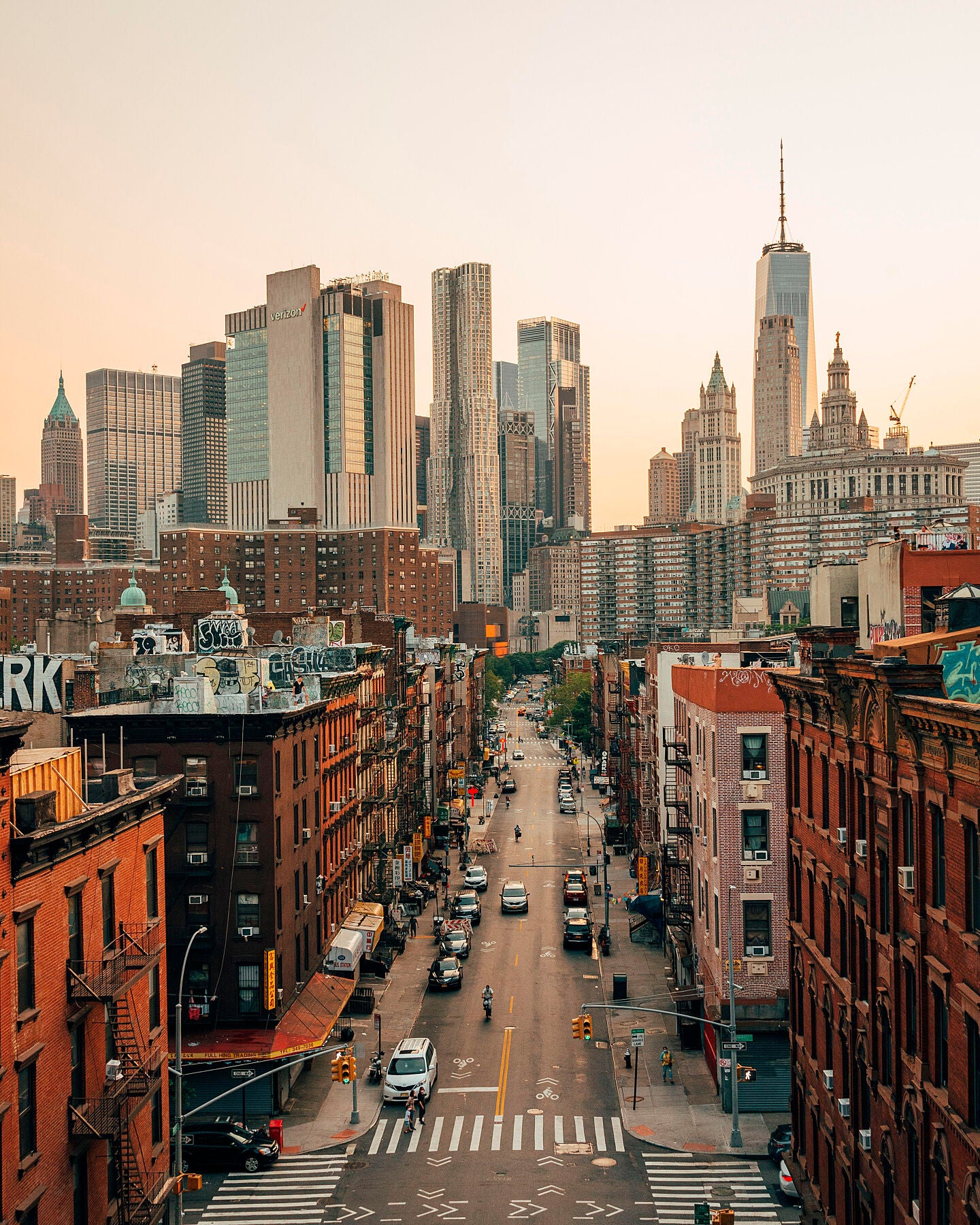 View of the Lower East Side and skyline of the Financial District from the Manhattan Bridge in the Lower East Side New York City USA - by Bridgeman Editions