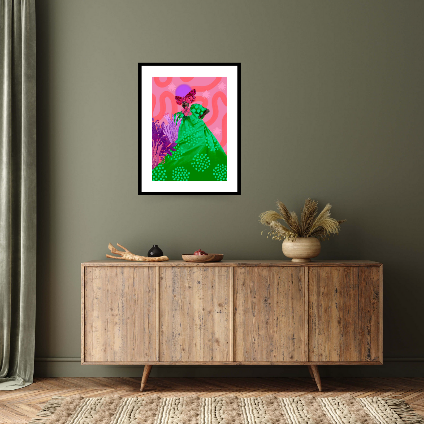 Image of the black framed  fine art print ‘Alais’ by the Contemporary artist Amber Elise, depicting a black woman wearing a long green dress and a butterfly shaped hat, standing on a bright pink background.