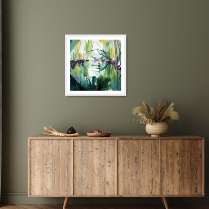 Set in an elegant interior the white framed print ‘Reflected’ by Charlotte Evans: A vibrant contemporary landscape where the multicoloured hues of mangroves are beautifully reflected in the tranquil waters