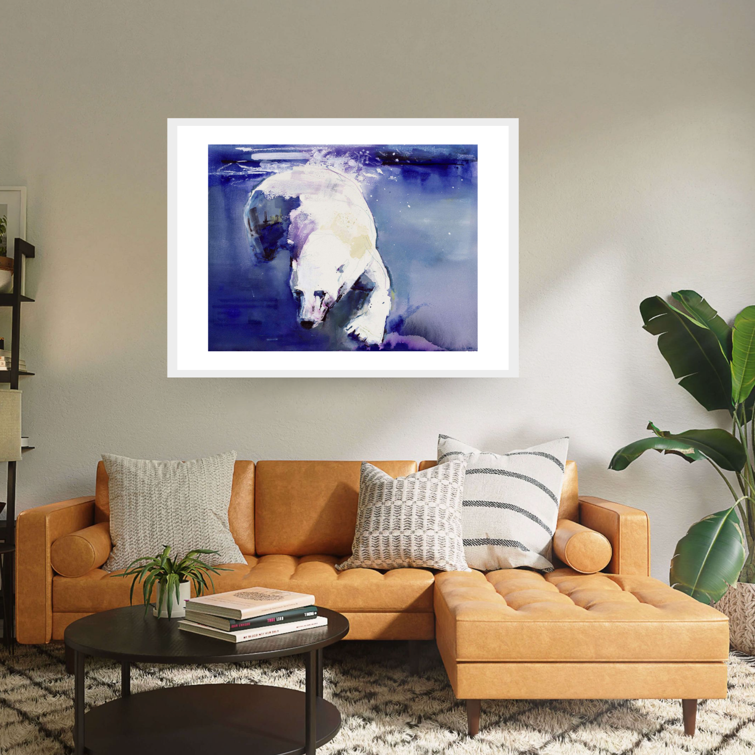 White framed 'Underwater Bear' by Mark Adlington. This artwork portrays a polar bear gracefully swimming beneath icy blue waters. Available as archival digital print, it's a stunning addition to any collection, capturing the beauty of wildlife in exquisite detail.