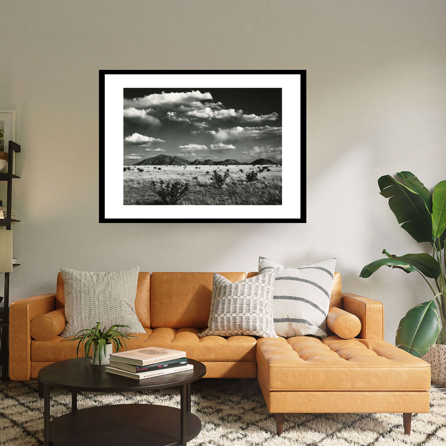 Immerse yourself in the breathtaking beauty of ‘Desert Landscape New Mexico’ by Brett Weston  This captivating black framed print encapsulates the rugged beauty of a desert vista, with majestic mountains and a dynamic cloudy sky.