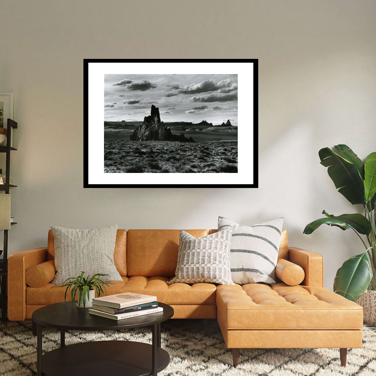 Black framed print 'Rock Formation Desert Landscape' by Brett Weston: A stunning and dramatic black & white photograph of a desert landscape with a cloudy sky.