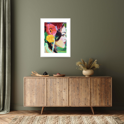 Image of the white framed print  ‘Electric Dreams' by Barbara Hoogeweegen depicting a woman facing right, with an array of flora in her hair, including two large pink and yellow flowers. The woman stands on a bright green background
