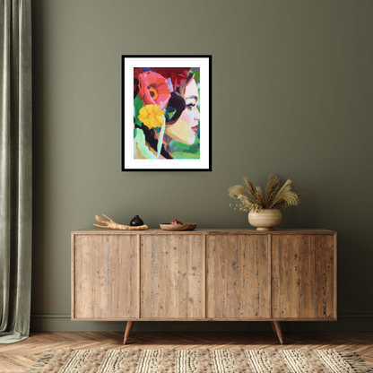 Image of the black framed print  ‘Electric Dreams' by Barbara Hoogeweegen depicting a woman facing right, with an array of flora in her hair, including two large pink and yellow flowers. The woman stands on a bright green background