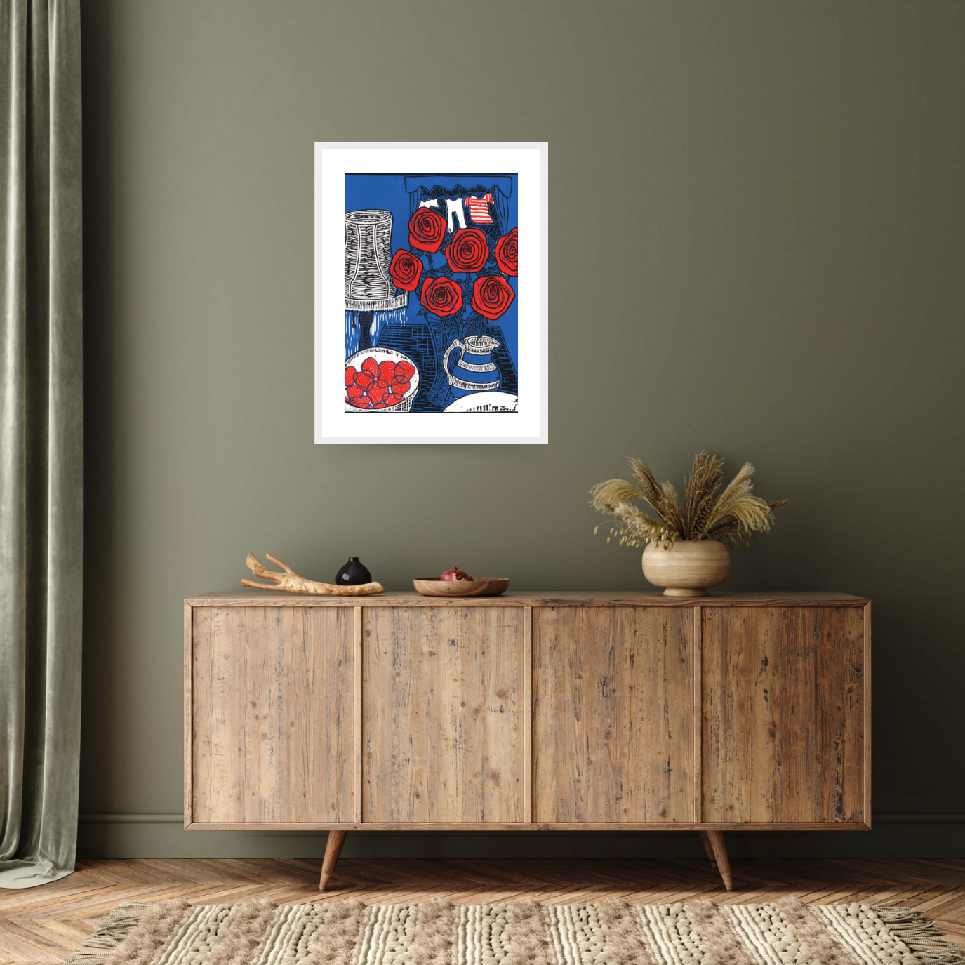 Discover the captivating 'Still life with Roses, 2014' by Faisal Khouja: a white framed fine art print featuring a linocut-style painting. With vibrant hues of intense blue, reds, and whites, this artwork showcases Faisal's intricate yet vibrant style, depicting a vase of roses, a lamp, and a bowl of strawberries.