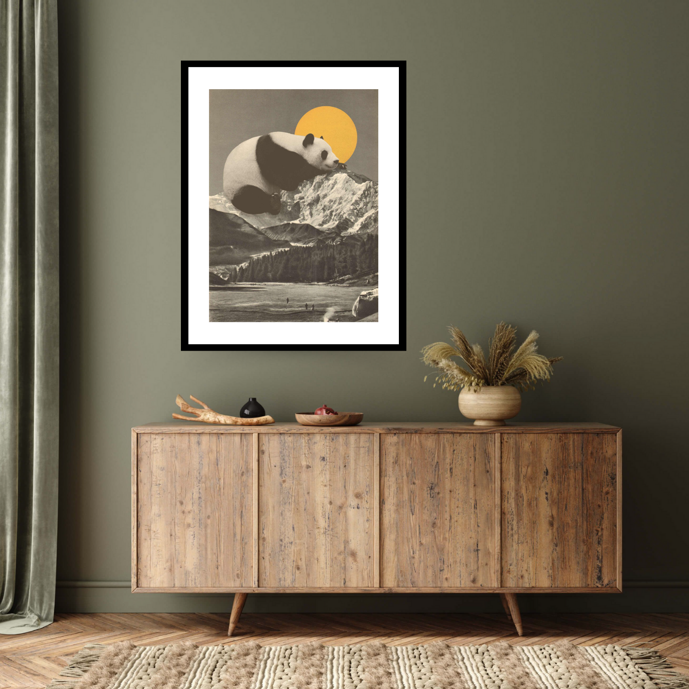 Black framed archival print: 'Pandas Nap into Mountains, 2020' by Florent Bodart. A panda rests atop snowy peaks under a golden sun. Printed on Hahnemühle German etching paper.