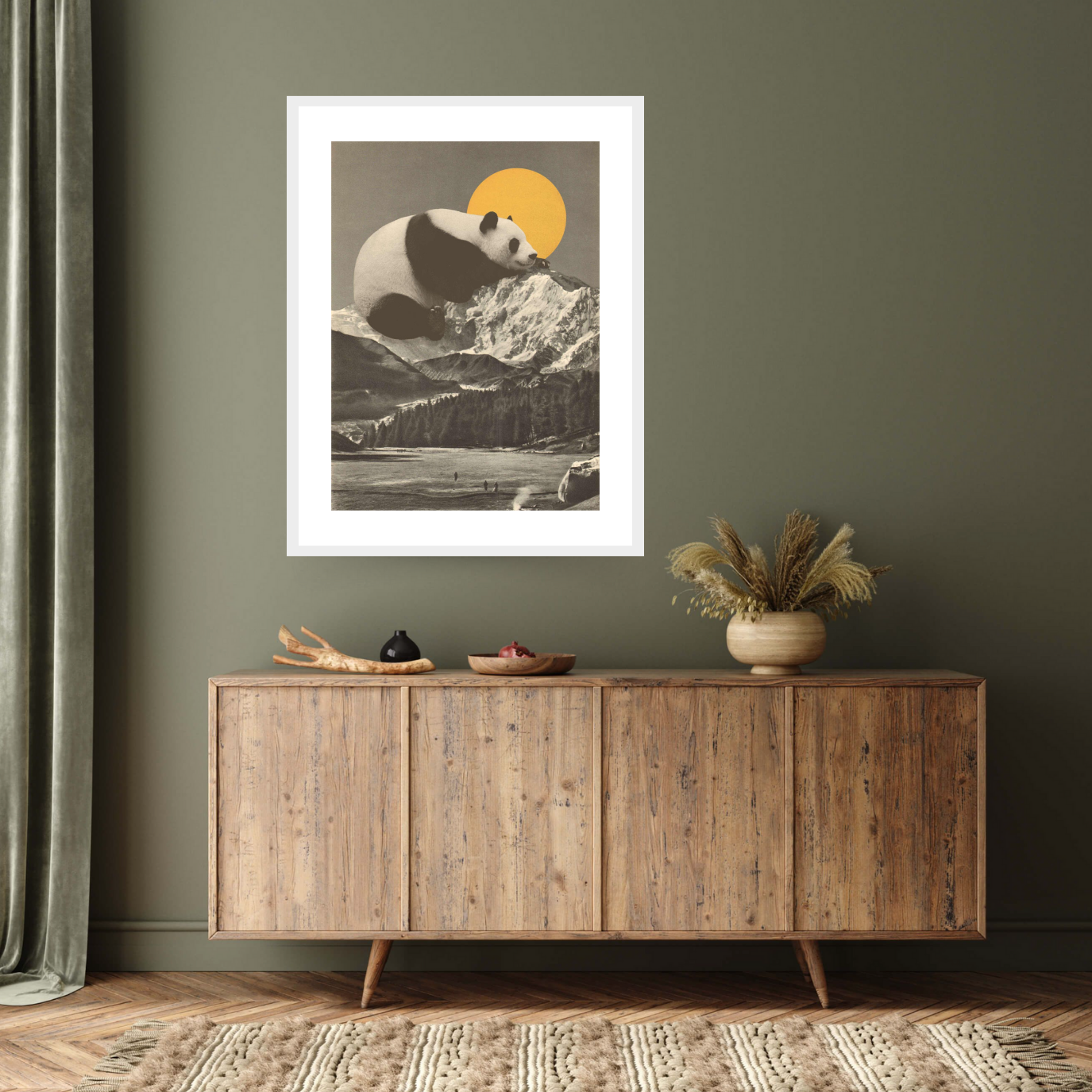 White framed archival print: 'Pandas Nap into Mountains, 2020' by Florent Bodart. A panda rests atop snowy peaks under a golden sun. Printed on Hahnemühle German etching paper.