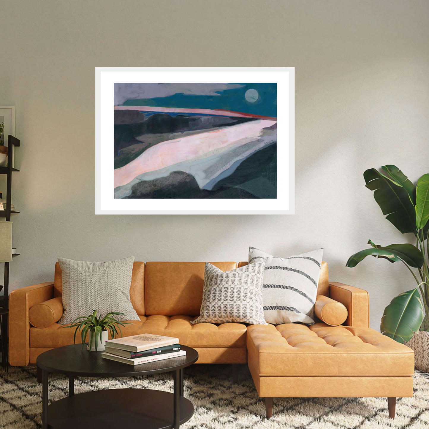 Dive into 'Broadstairs' by David McConochie: an abstract minimalist rural landscape, available as a white framed print. Tones of grey, teal, and pink paint a coastal scene, illuminated by a cool full moon. Let this serene artwork transport you to tranquil shores