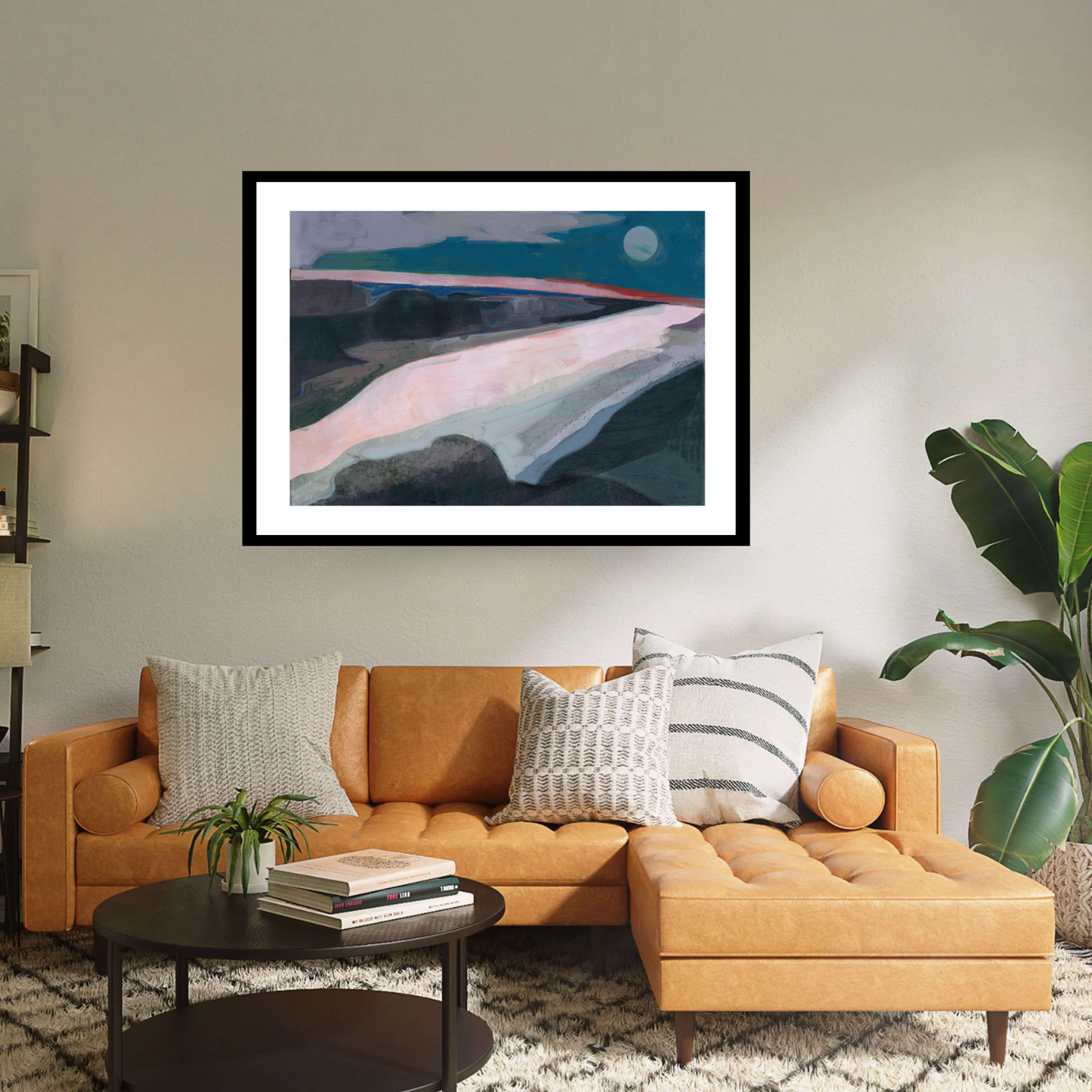 Dive into 'Broadstairs' by David McConochie: an abstract minimalist rural landscape, available as a black framed print. Tones of grey, teal, and pink paint a coastal scene, illuminated by a cool full moon. Let this serene artwork transport you to tranquil shores