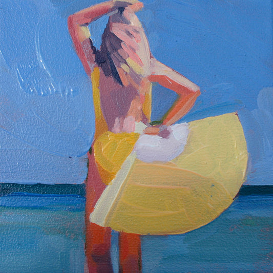 Unframed print 'Face 27' by Barbara Hoogeweegen: A blond woman in a yellow swimsuit stands with her back to the viewer, holding a large fan and gazing at the blue sea horizon.